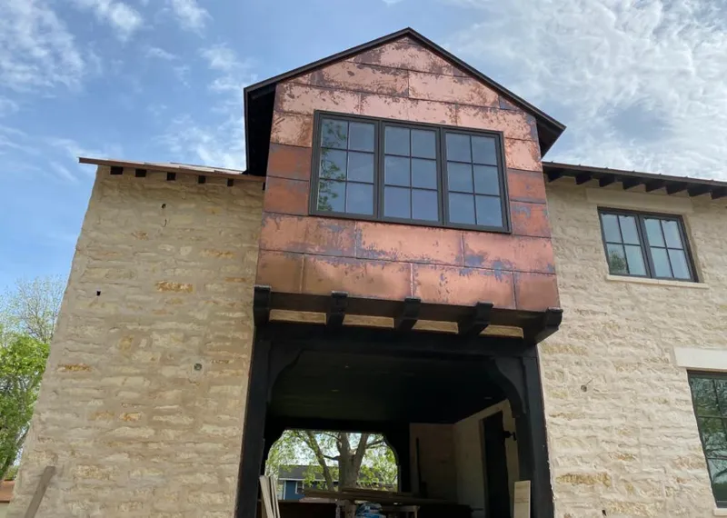 Copper metal panel facade on a stone building for Metal Roof Coating in San Mateo