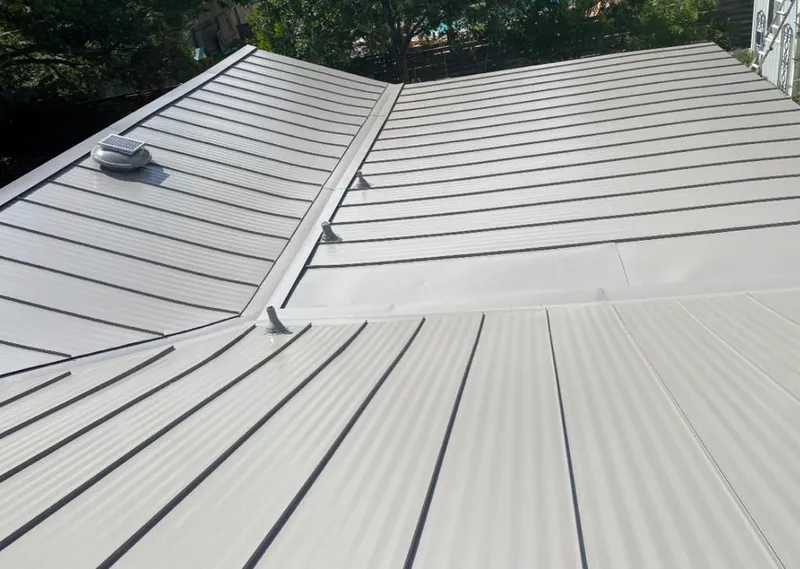 Solar attic fan installed on a metal roof for Roof Ventilation in San Mateo